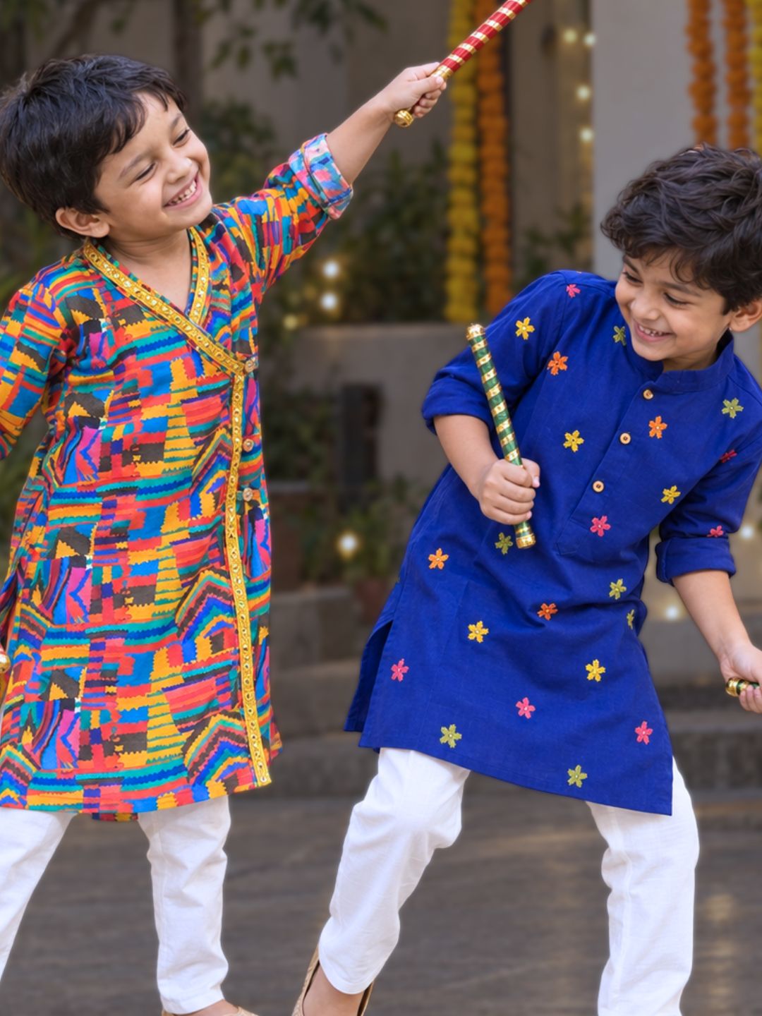 boys playing dandiya in comfortable kurtas for navratri 