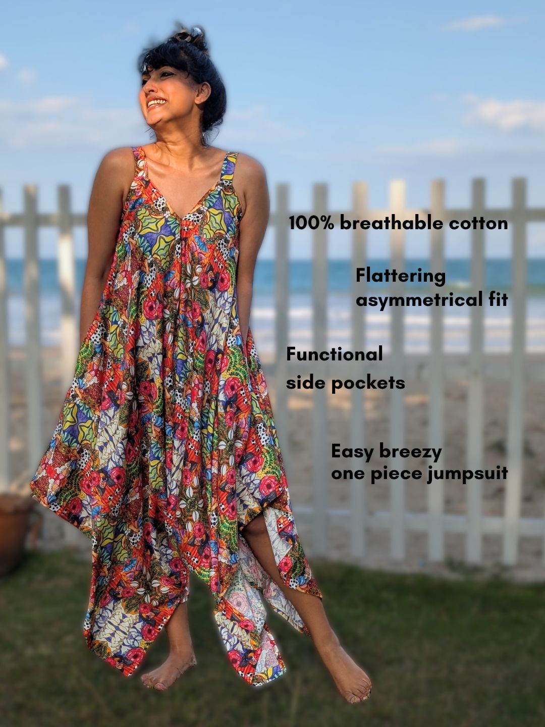 Woman wearing a colorful floral one-piece jumpsuit with text describing its features, standing outdoors.