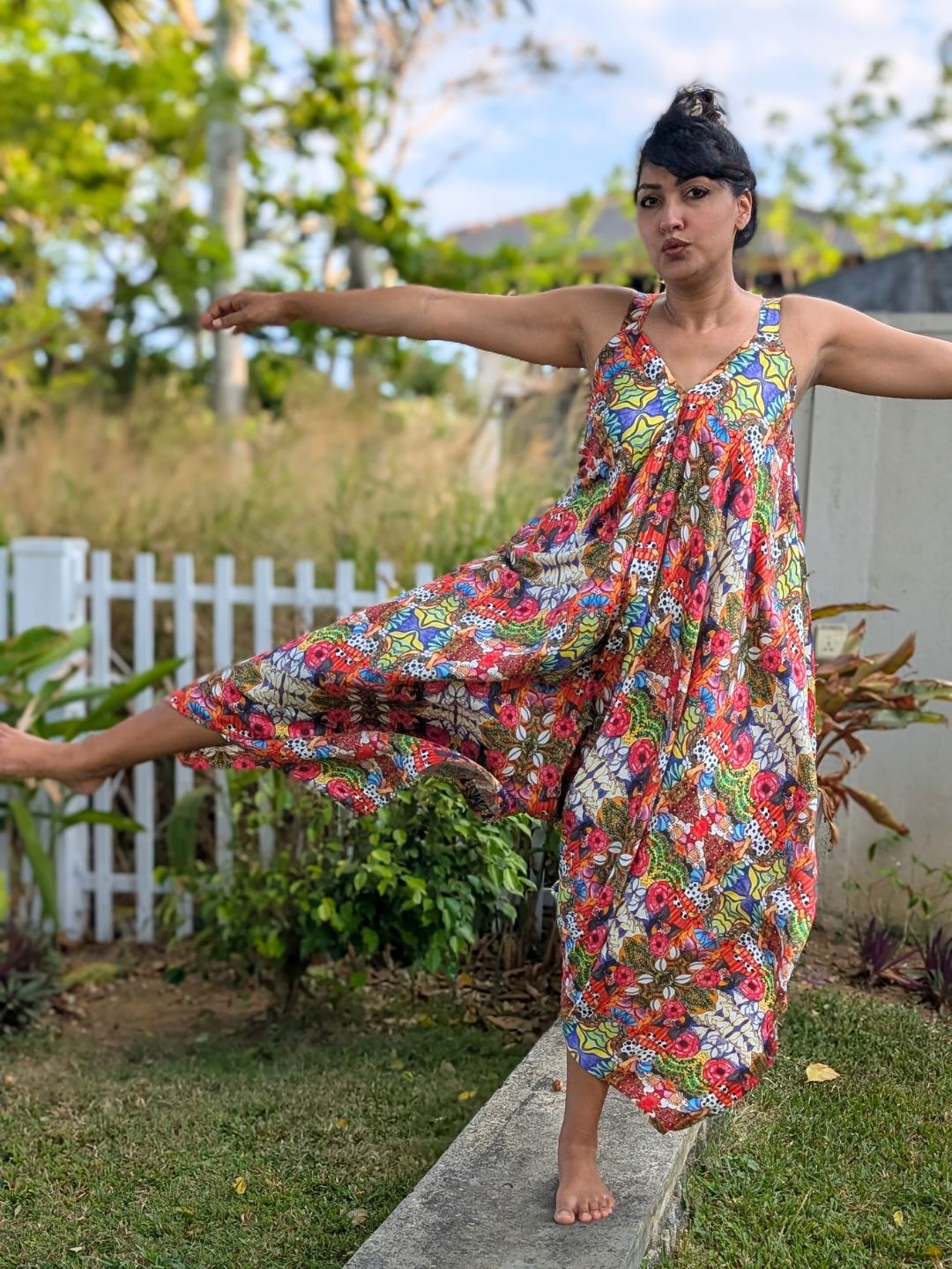 Floral asymmetrical cotton jumpsuit styled for resort vacation wear