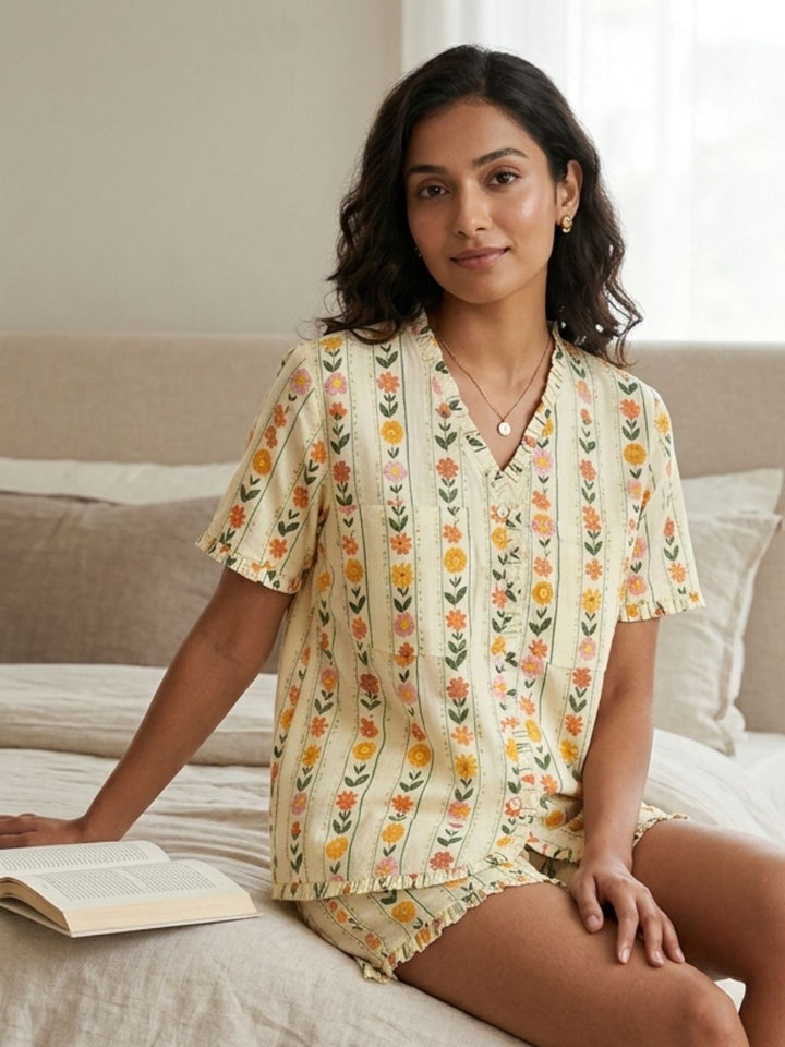 Woman wearing a floral pinstriped front open feeding friendly pajama set 