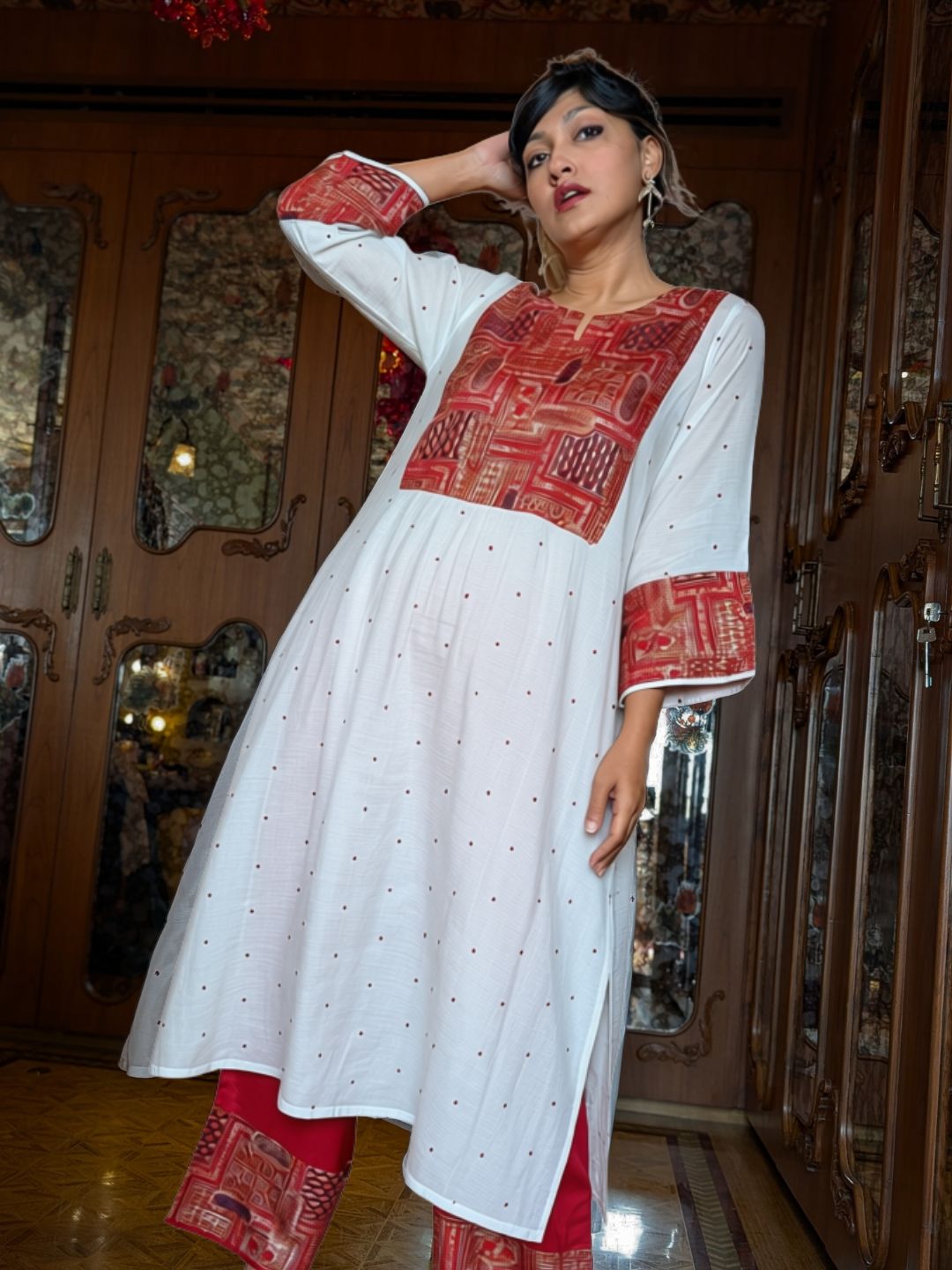 Woman in off-white Utsav cupro silk kurta with maroon embroidered yoke and cuffs, maroon buti and maroon embroidered pants – photo 1 – Tura Turi