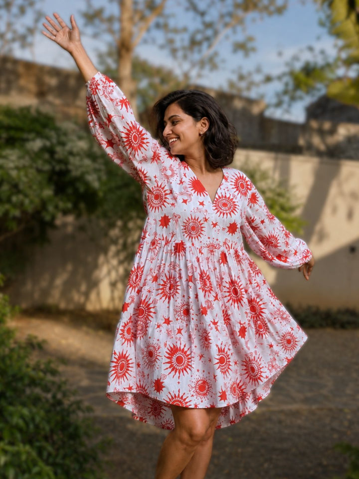 Cotton mini dress for women with V-neck, long sleeves and playful flared shape