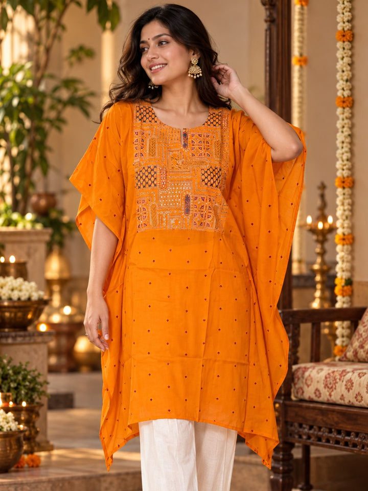 Woman in orange Utsav cupro silk kaftan with embroidered yoke, maroon buti and handkerchief hem, with off-white pants – photo 5 – Tura Turi