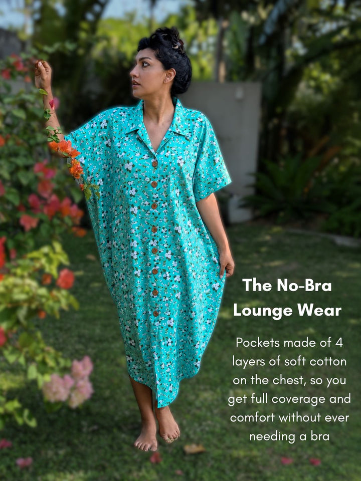 Woman wearing a teal floral dress in a garden setting with text about the no-bra lounge wear.
