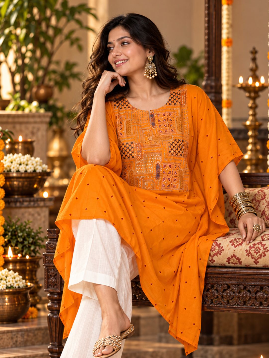 Woman in orange Utsav cupro silk kaftan with embroidered yoke, maroon buti and handkerchief hem, with off-white pants – photo 2 – Tura Turi