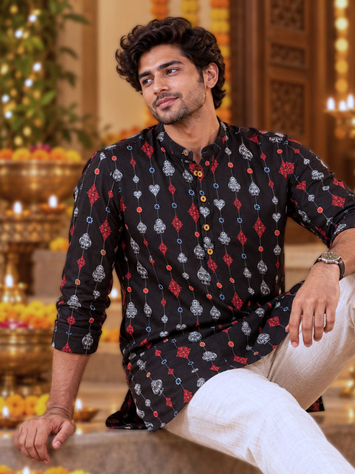 Close-up of the playing-card motif print on the Tura Turi men&