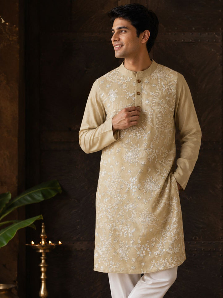 man wearing sandal colour kora silk kurta with white embroidery