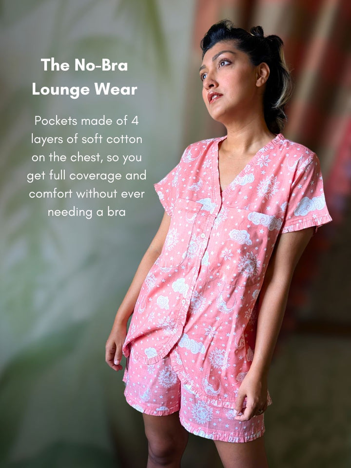 Woman wearing pink lounge wear with text about no-bra design