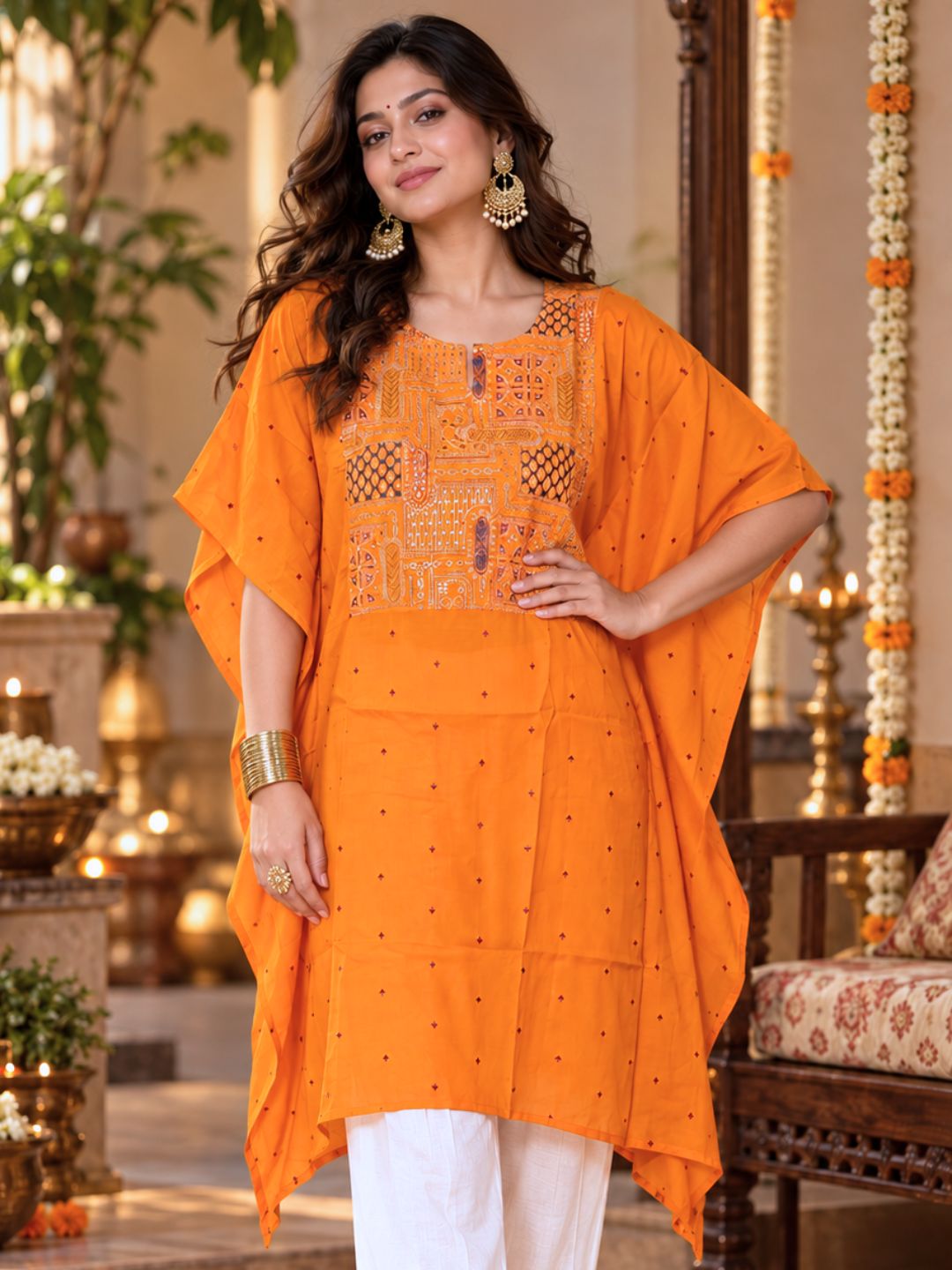 Woman in orange Utsav cupro silk kaftan with embroidered yoke, maroon buti and handkerchief hem, with off-white pants – photo 3 – Tura Turi