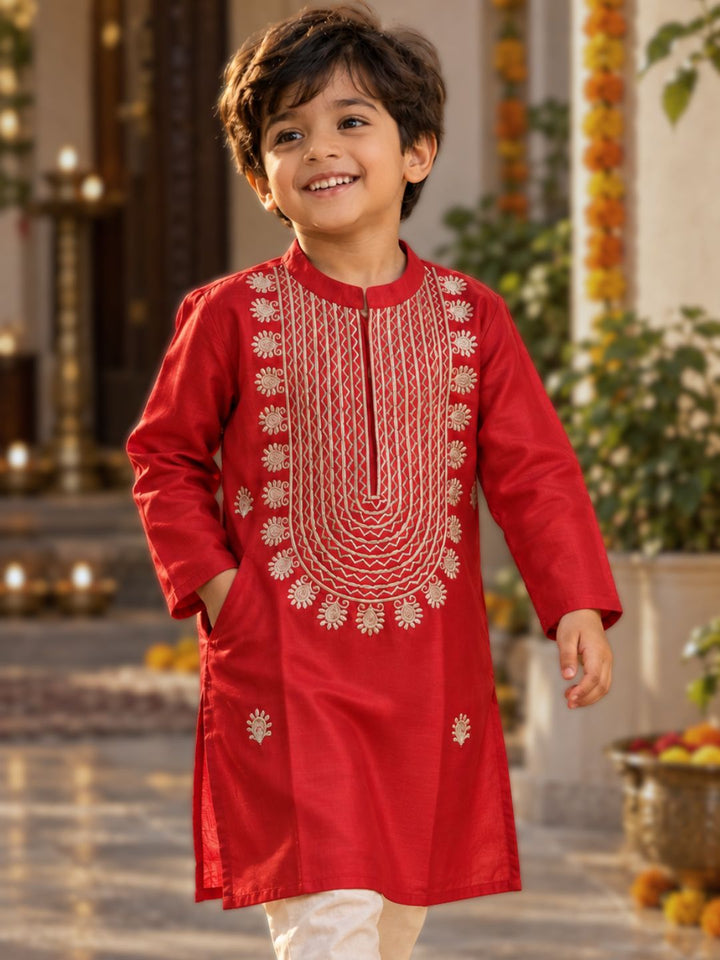 boy wearing festive red silk kurta for diwali and dussehra celebrations 