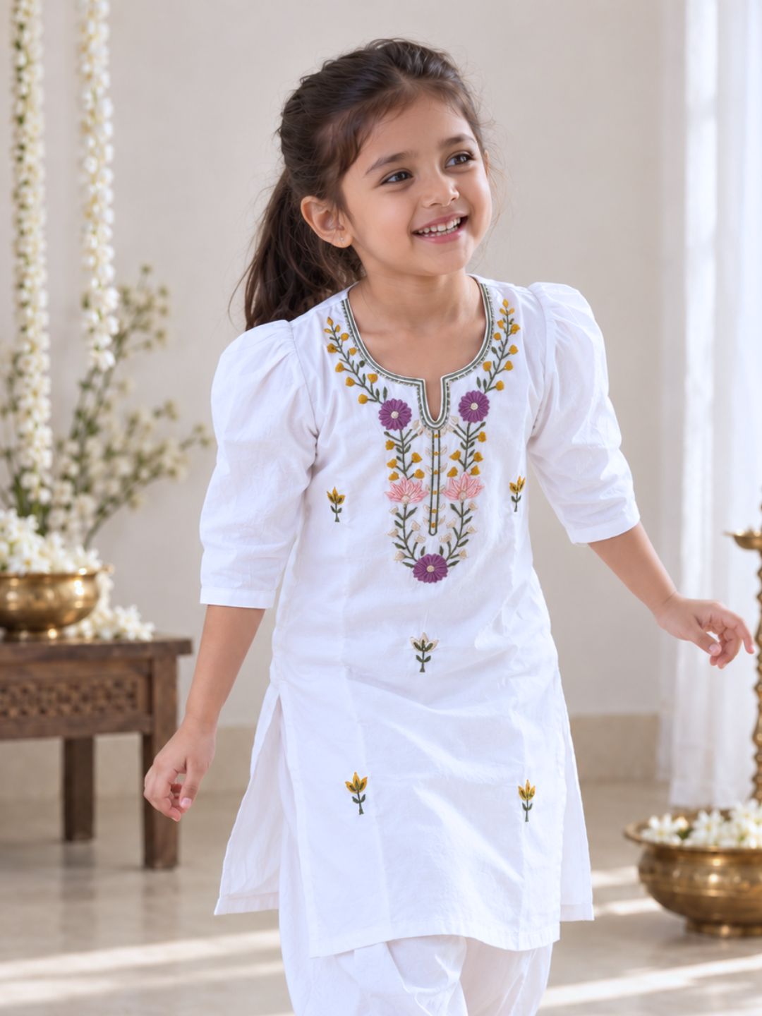 Comfortable white pure cotton kurta for girls with handcrafted-style floral embroidery for everyday celebrations
