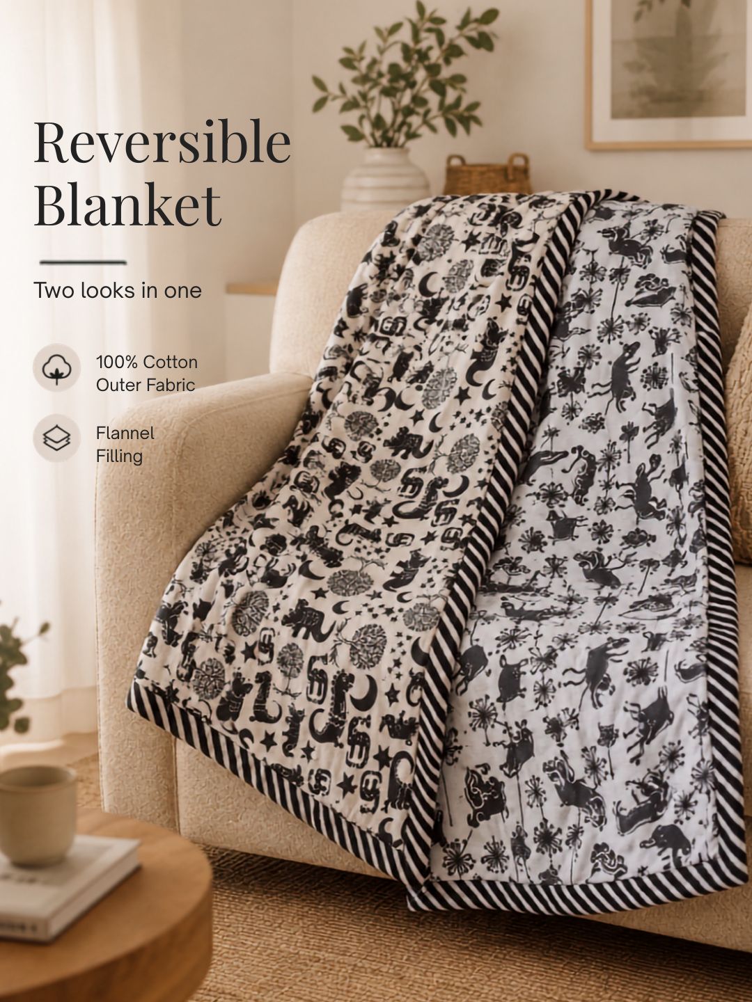 Tura Turi reversible cotton kids blanket with dinosaur print and farm-animal print sides and a black-and-white striped border