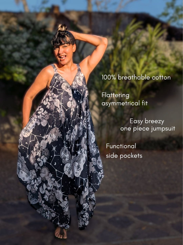 Woman wearing a designer jumpsuit with text highlighting features on a blurred outdoor background