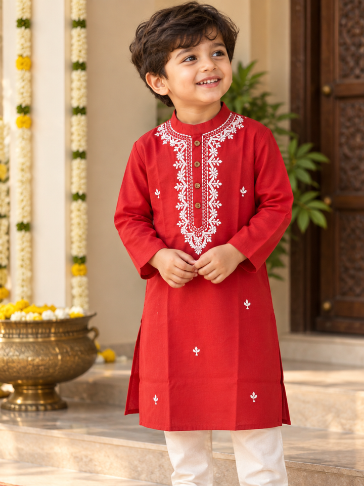 Close-up of white floral and leaf thread embroidery on red malmal kurta yoke – Tura Turi