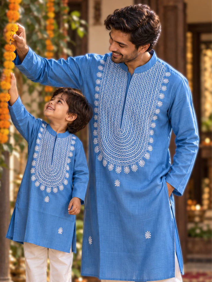 Boy and man in matching French blue cupro silk Tashan kurtas with white resham embroidery