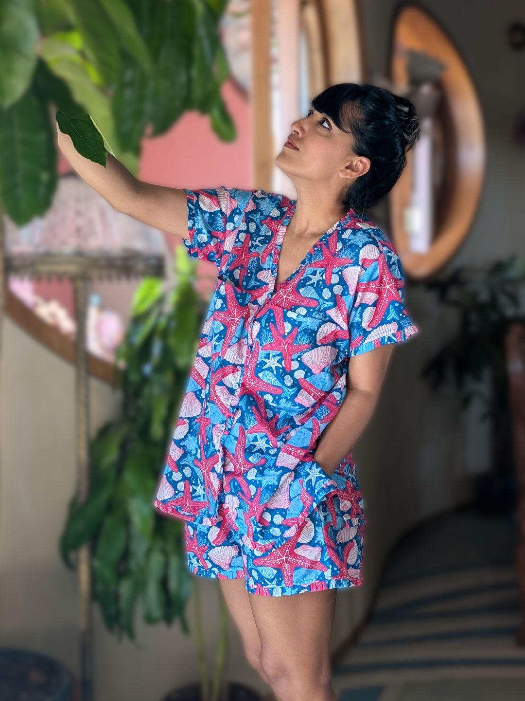 Woman wearing a colorful starfish-patterned summer loungewear nightsuit 