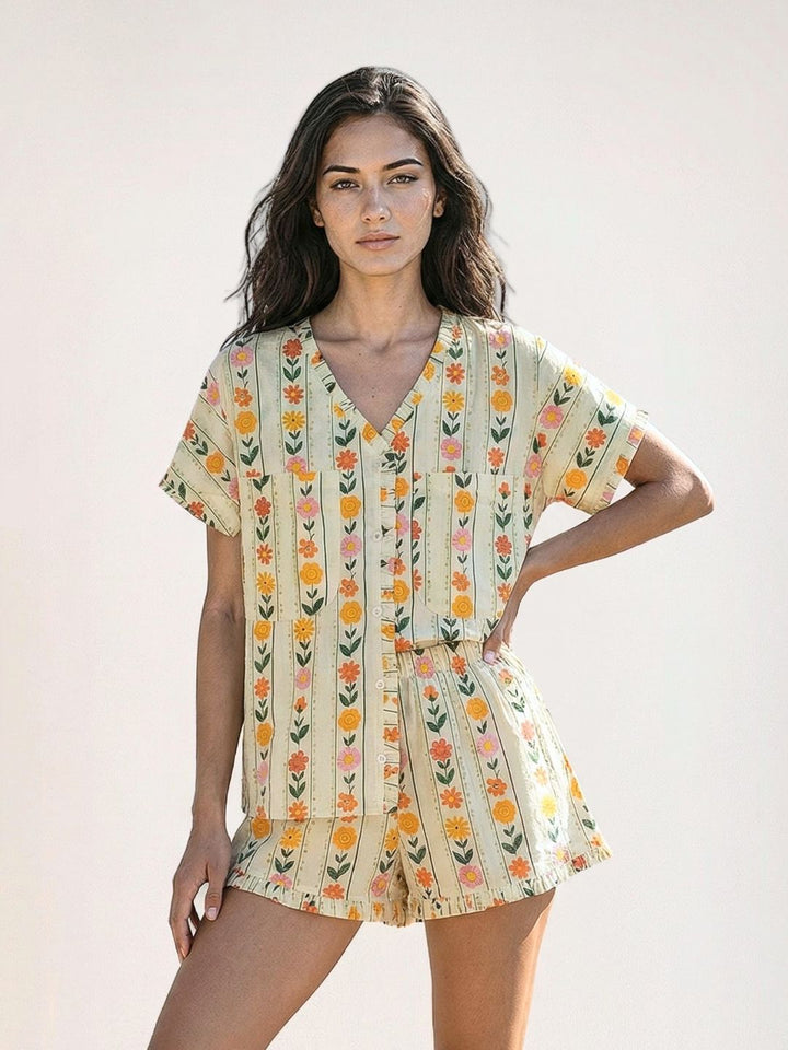 Woman wearing a floral pinstripe pattern with marigold and flowers. shorts and shirt in no bra nightsuit pattern. 
