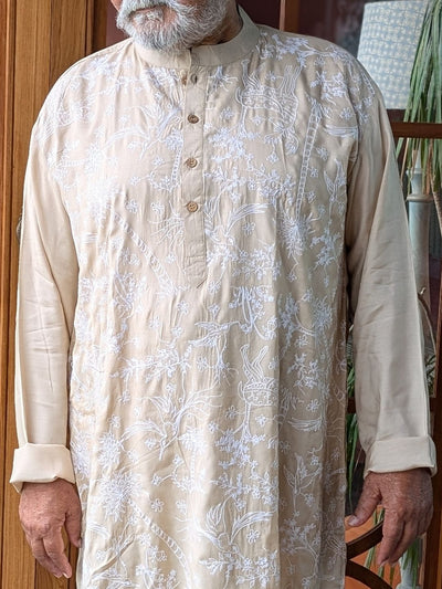 running embroidery on mans kurta 