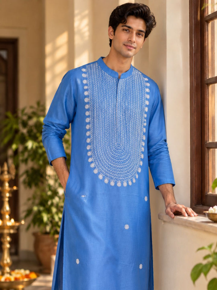 Man in French blue cupro silk kurta with white resham embroidery for Diwali