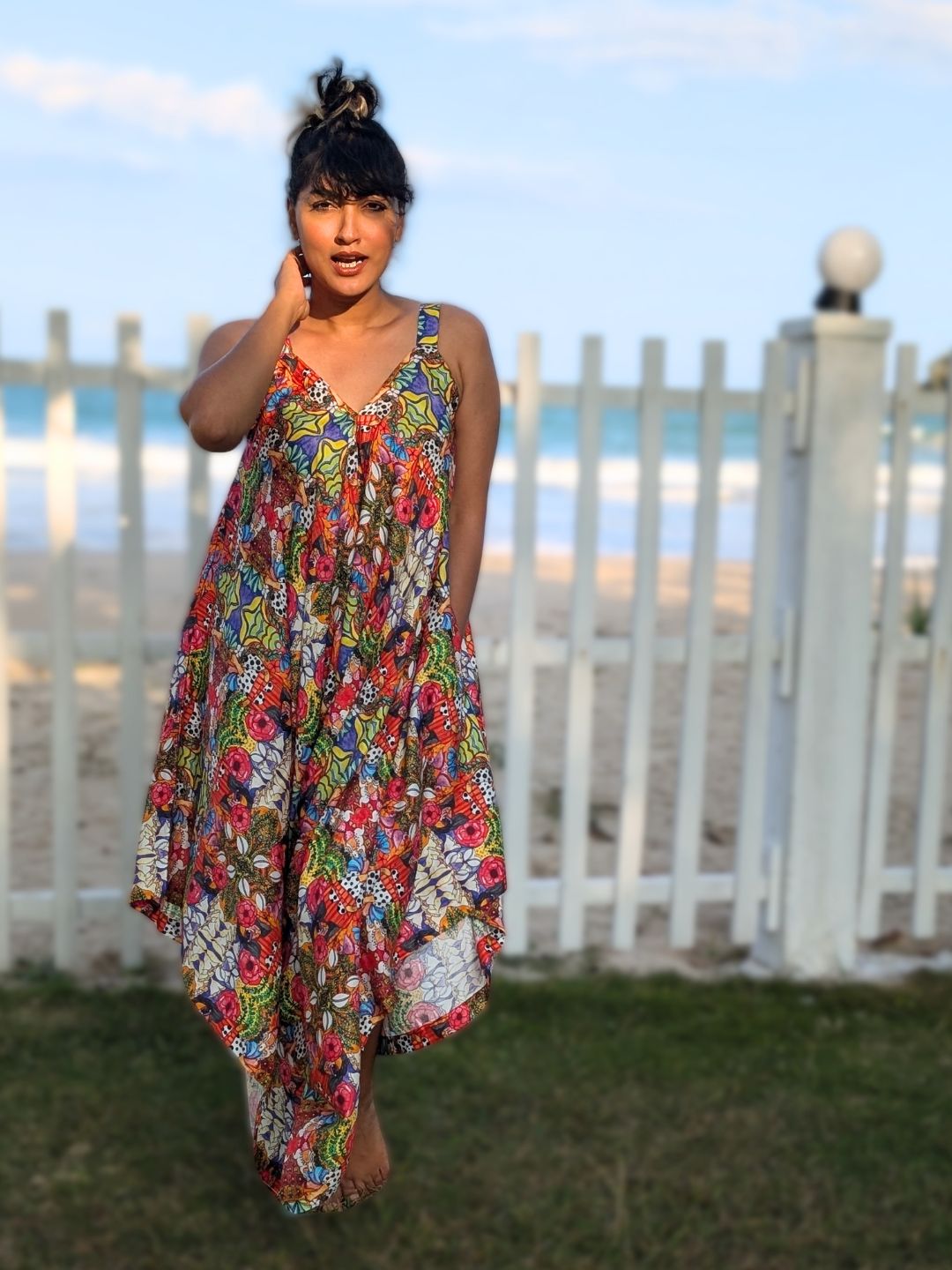 Resort wear cotton jumpsuit with relaxed drape and flowing silhouette
