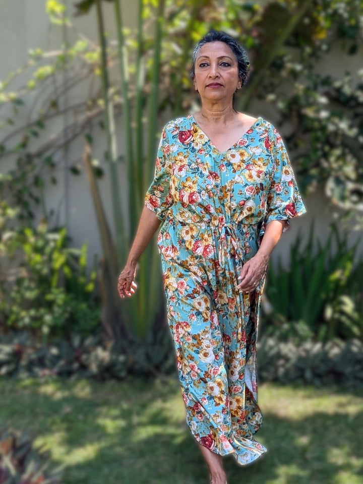 Woman in a cotton floral no bra kaftan nightie