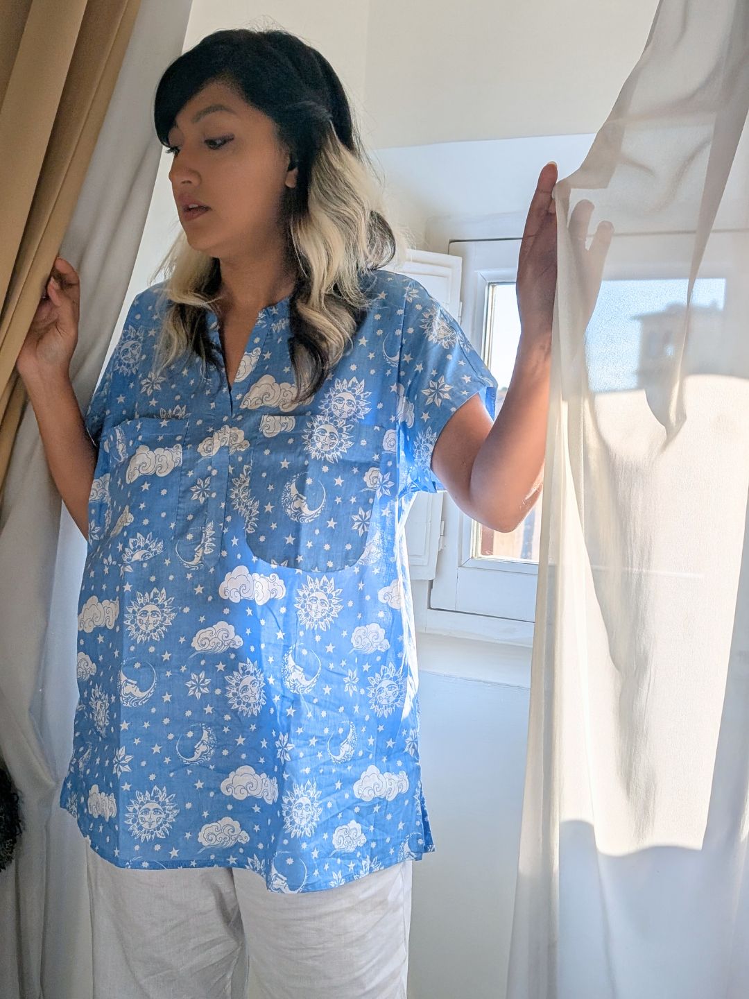 woman wearing blue night suit that has pockets for coverage and can be worn without a bra