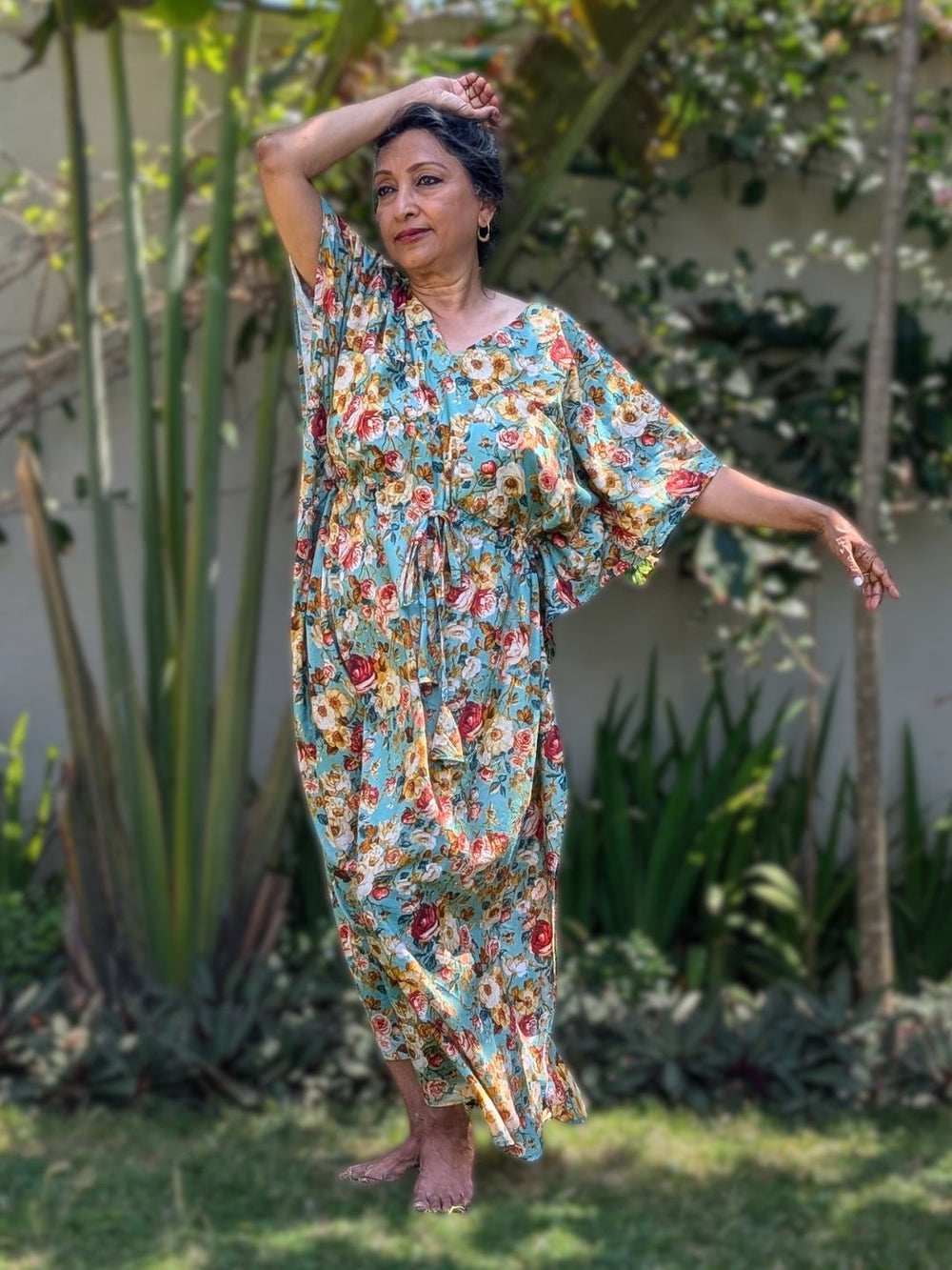 old Woman in a cotton floral no bra kaftan nightie and loungewear