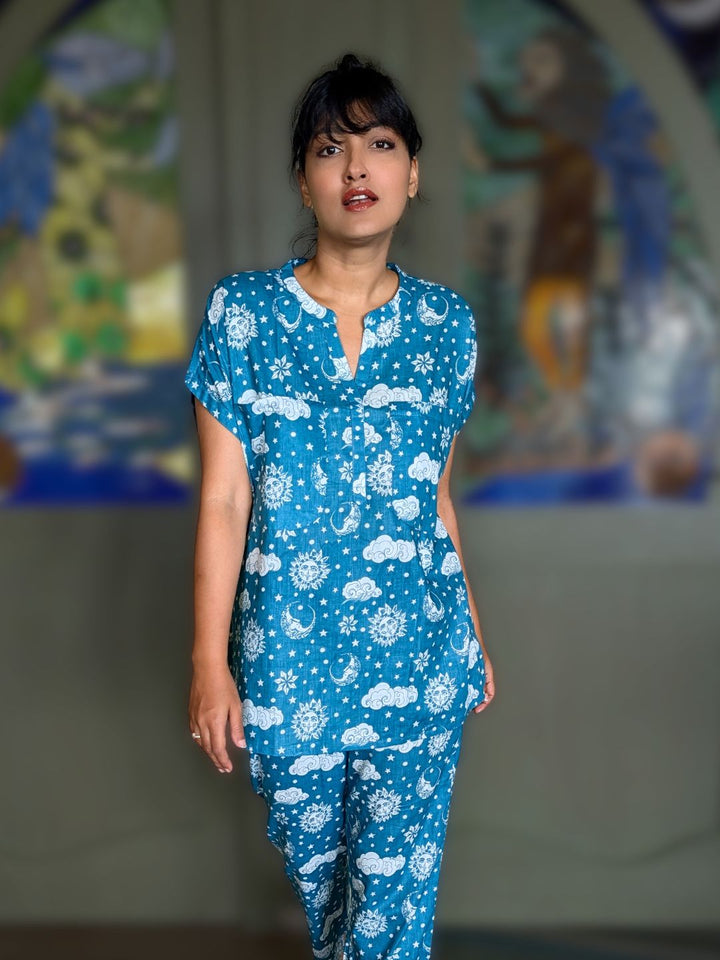woman in a turaturi no bra nightsuit in cotton malmal with same print top and bottom coord style. 