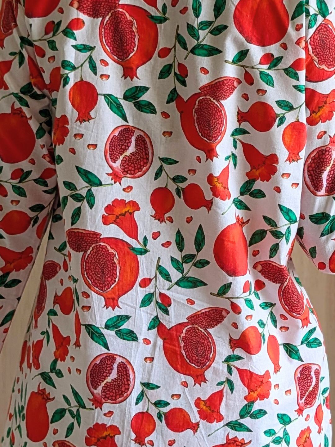 COTTON Fabric with red pomegranate pattern on a white background