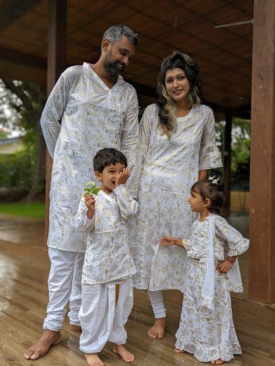 family twinning in white and gold indian ethnic outfits