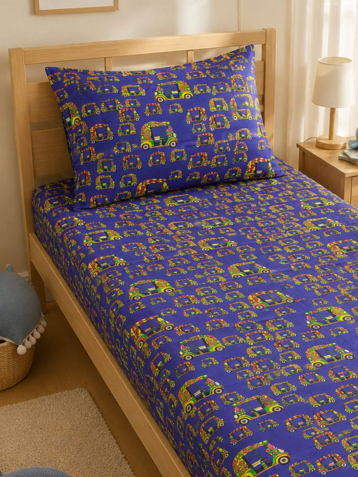 Cotton single bedsheet and pillowcase in vibrant tuk-tuk print, styled in a cheerful children’s bedroom.