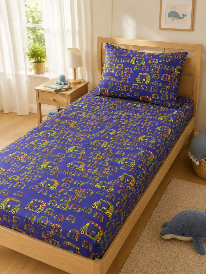 Bright blue autorickshaw print cotton bedsheet for kids with matching pillow cover, styled on a single bed.