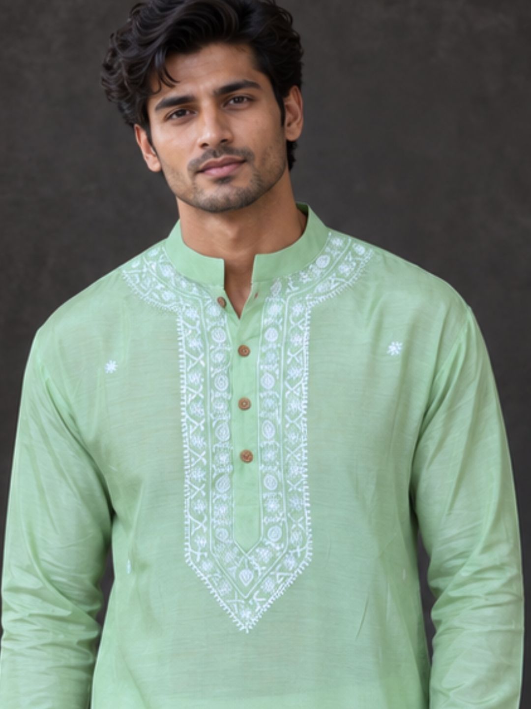 close up of man wearng silk mint green kurta. perfect light festive wear for diwali, and wedding season, mehendi and sangeet functions