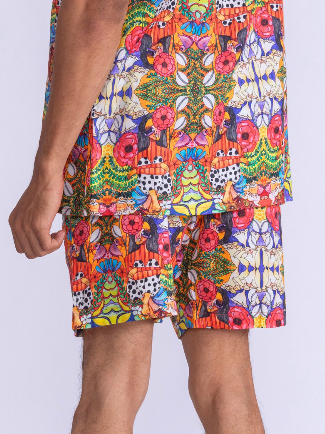 Colorful patterned mens shorts on a plain background