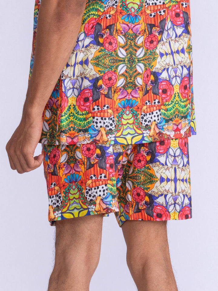 Colorful patterned mens shorts on a plain background