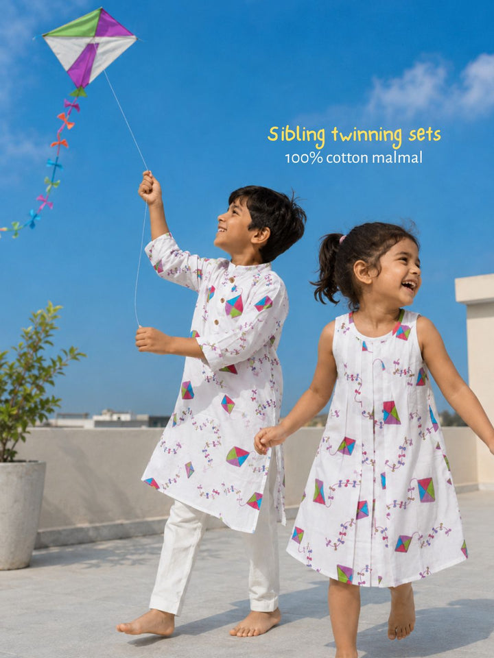 Kites print cotton malmal dress for girls with wooden buttons