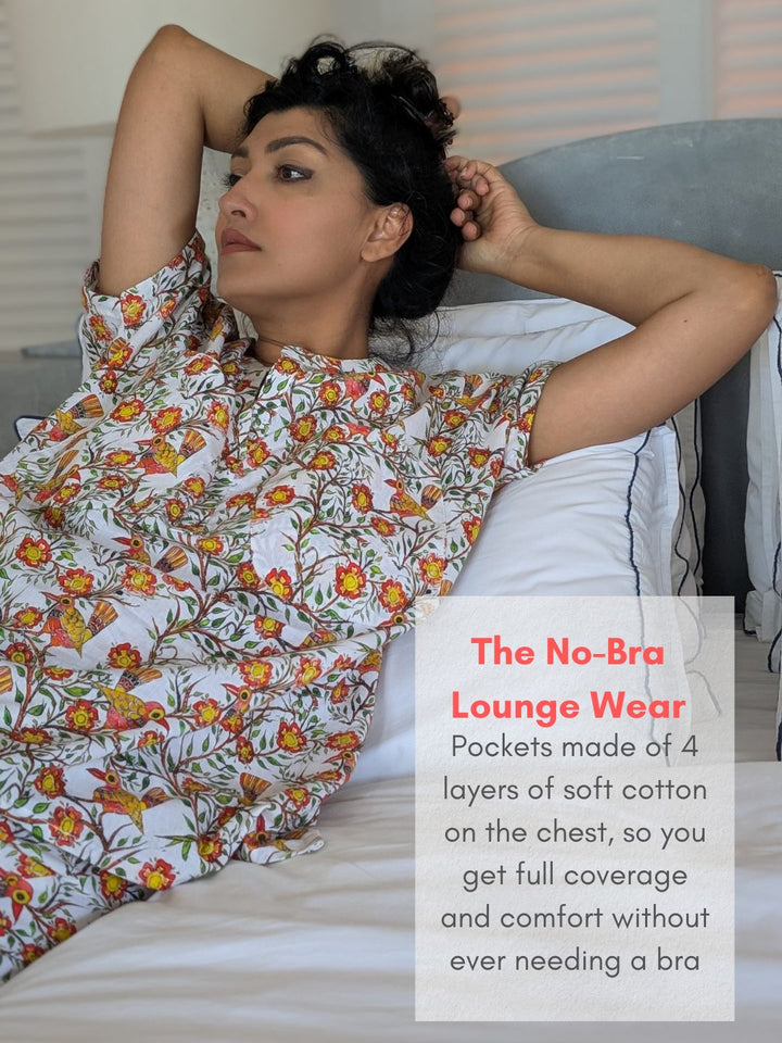 Woman wearing a floral no-bra lounge wear outfit on a bed with promotional text overlay.