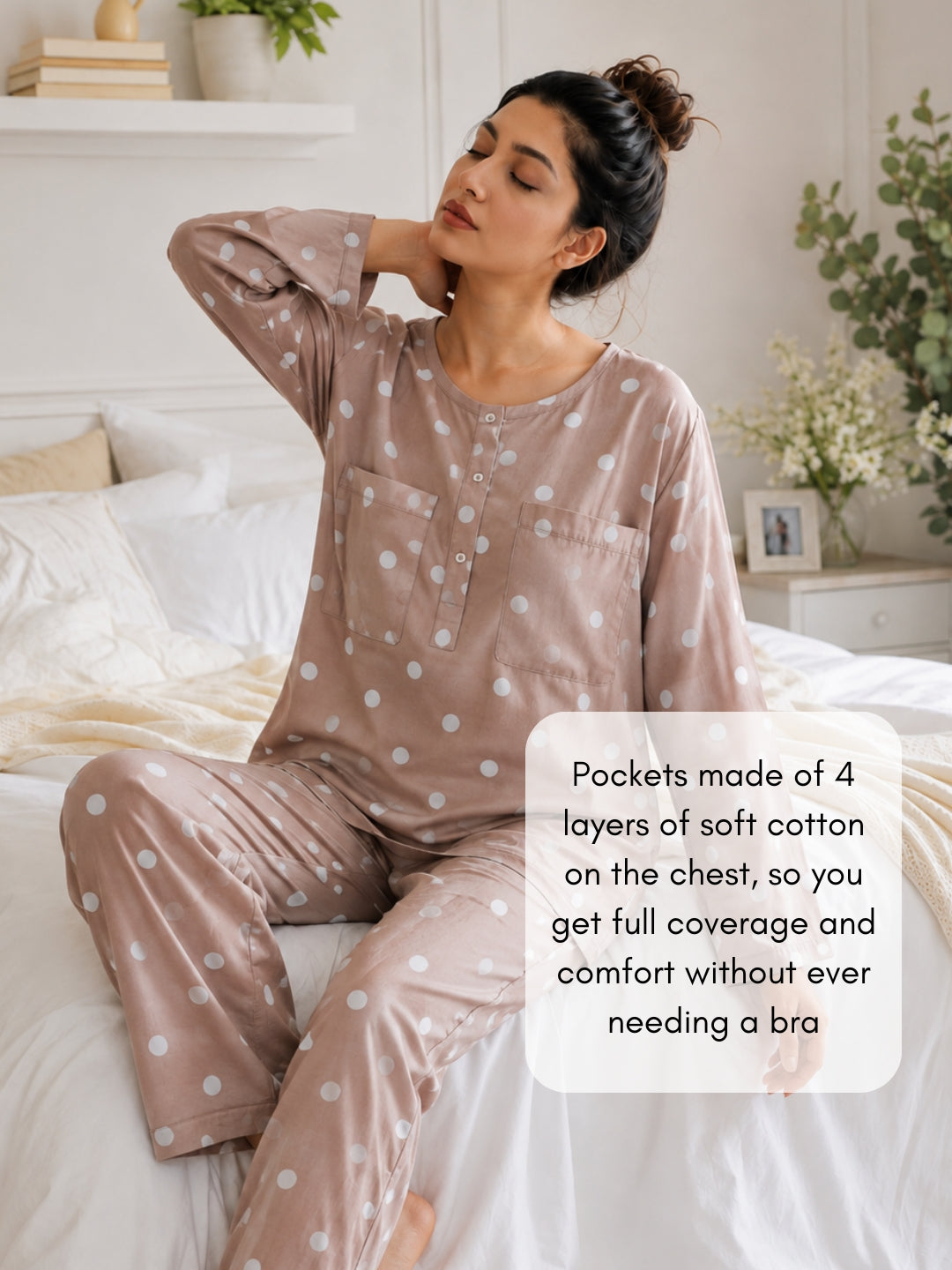 Woman on a bed in a Tura Turi mocha polka dot night suit; the top&