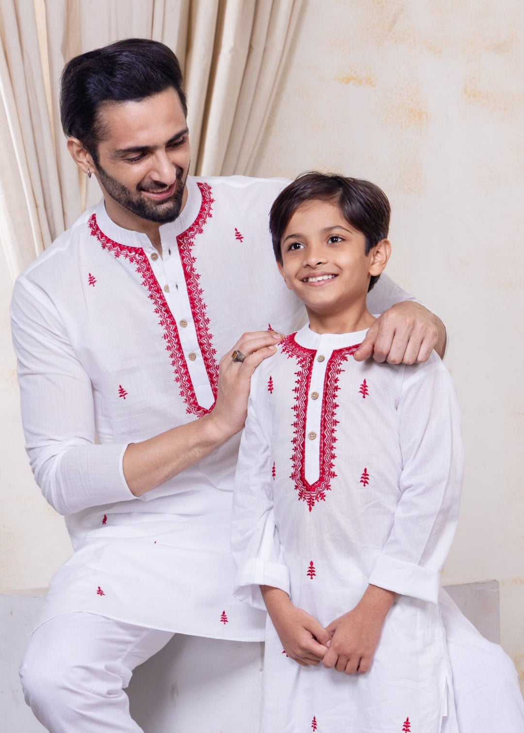 white cotton kurta with elegant red embroidery