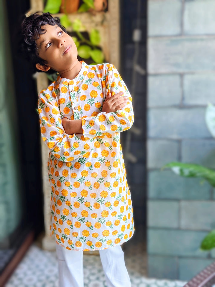 Orange and white marigold print malmal cotton kurta for boys