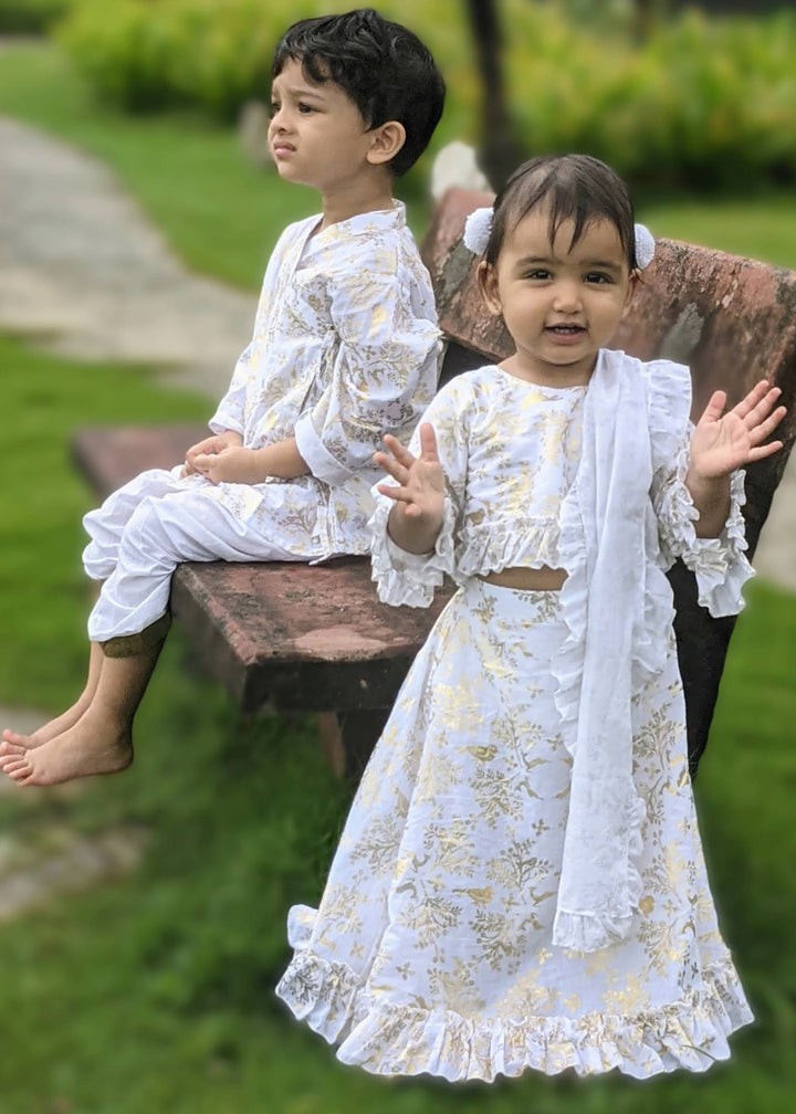 white and gold kids dress for onam