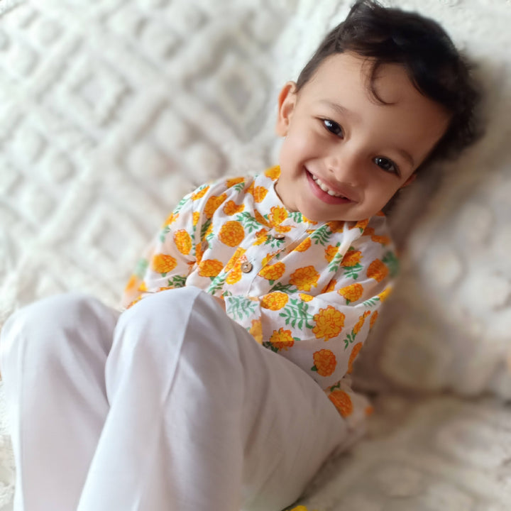 Close up of Marigold block print on soft cotton malmal kurta fabric