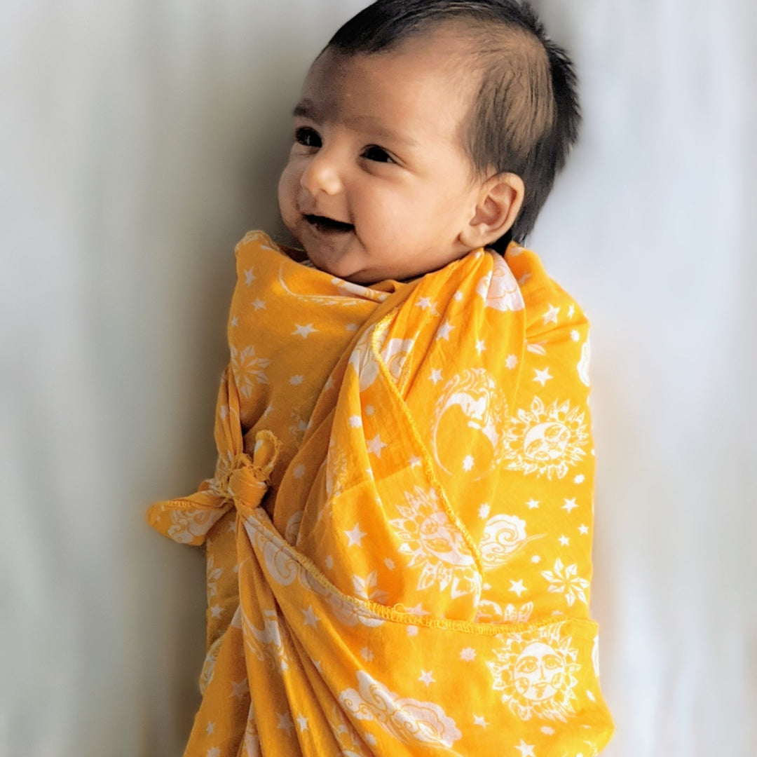 festive yellow swaddle for newborn
