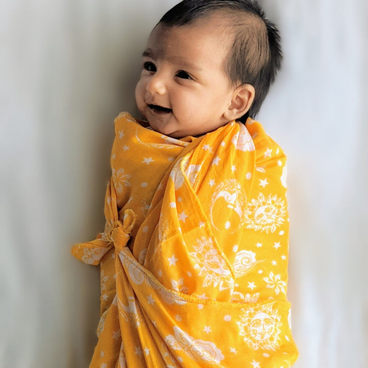 festive yellow swaddle for newborn